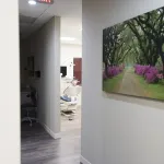 Interior photo of from hallway, looking into a clean and relaxing treatment room