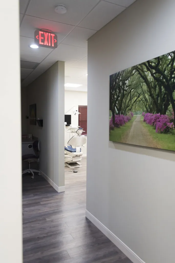 Interior photo of from hallway, looking into a clean and relaxing treatment room
