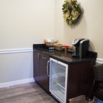 Interior photo: St James NY Dental waiting room amenities: cold water, snacks, and coffee